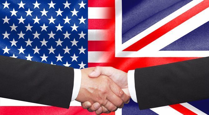 Handshake over US and UK flag image