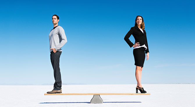 Man and woman standing on scales