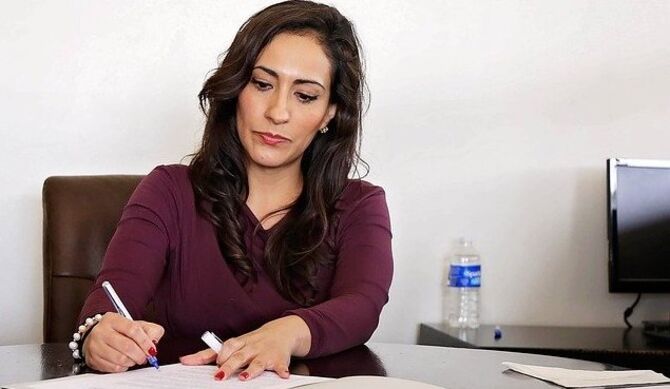 Women signing paperwork