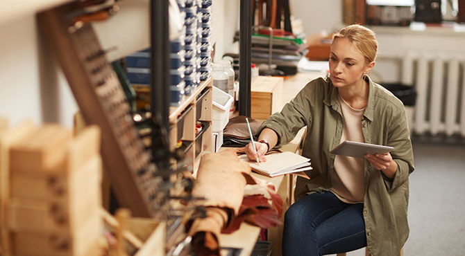 A serious young woman in a workshop