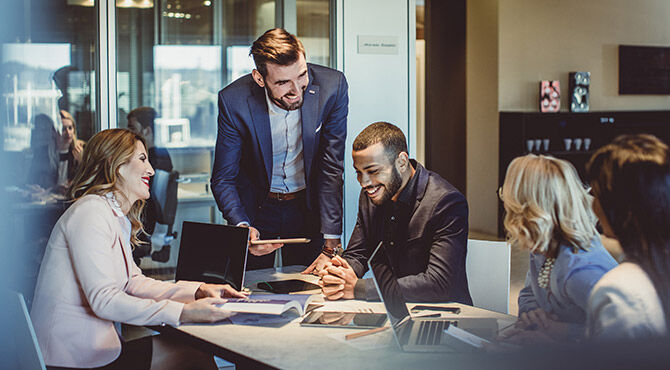 Workers at desk in office