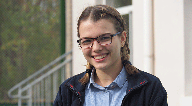 Smiling girl in school uniform